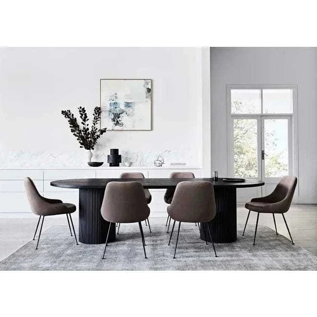 Benjamin Ripple Oval Dining Table in matt black with rippled pillar bases and oval ash veneer top in contemporary dining room setting