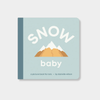 Cover of the Snow Baby board book for toddlers featuring mountain illustration and bold text on a light blue background.