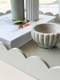 norsu STUDIO Rectangular Scalloped Tray in sage with hand-lacquered finish and scalloped edges holding decorative items