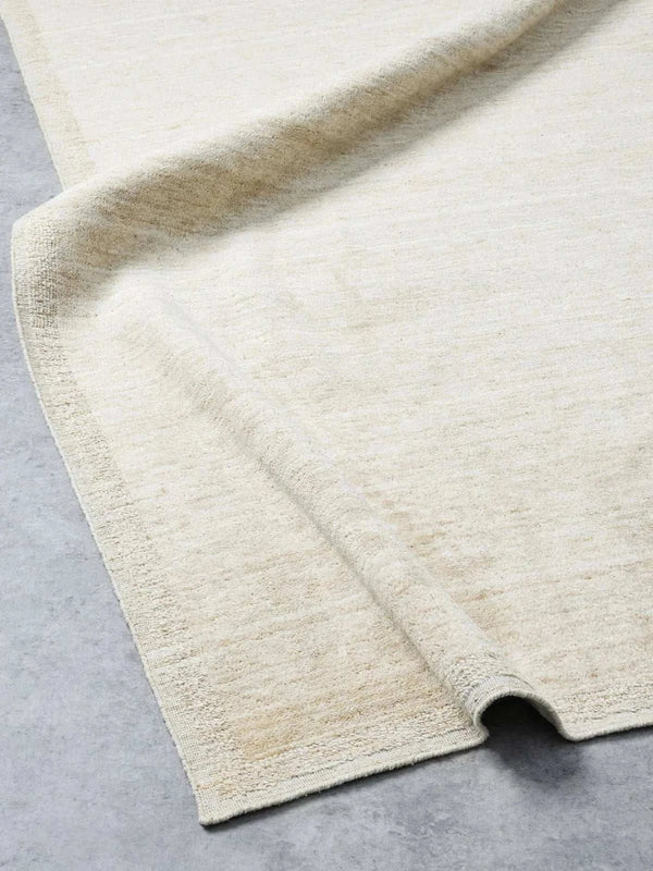 Chelsea Rug Natural Ivory hand-loomed 100% wool with refined border and soft creamy tone