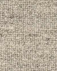 Close-up texture of Baya Clifton Floor Rug in ash color with soft, looped, handcrafted 100% New Zealand wool pile.