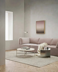 Baya Clifton Floor Rug in ash tone with softly looped pile on wooden floor in modern living room setting