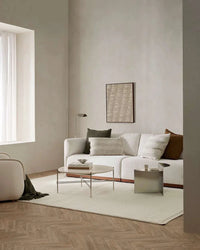 Ivory Baya Clifton Floor Rug in minimalist living room with wooden floor and neutral furniture
