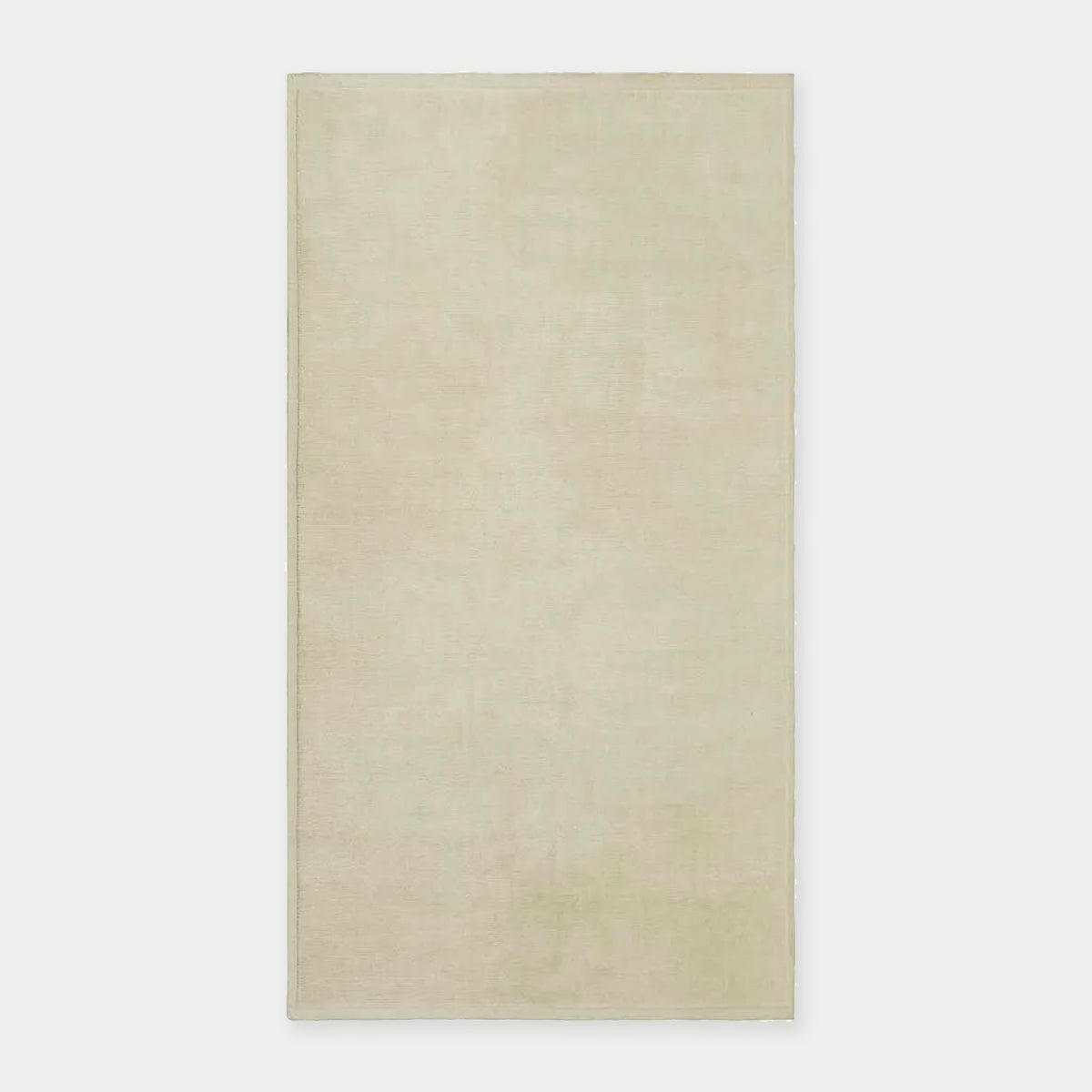 GlobeWest Bower Frame Rug in cloud color, handwoven 100% wool indoor area rug with simple silhouette.