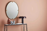 Globe West Canopy Table Lamp in burgundy with modern metal design on console table under round wall mirror