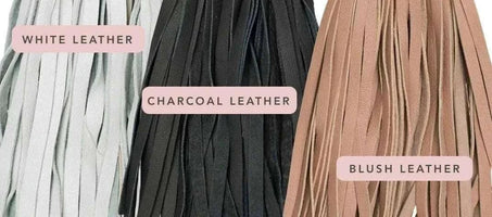 Close-up of white, charcoal, and blush leather piping options for the Pickle Bouclé Ottoman upholstery customization