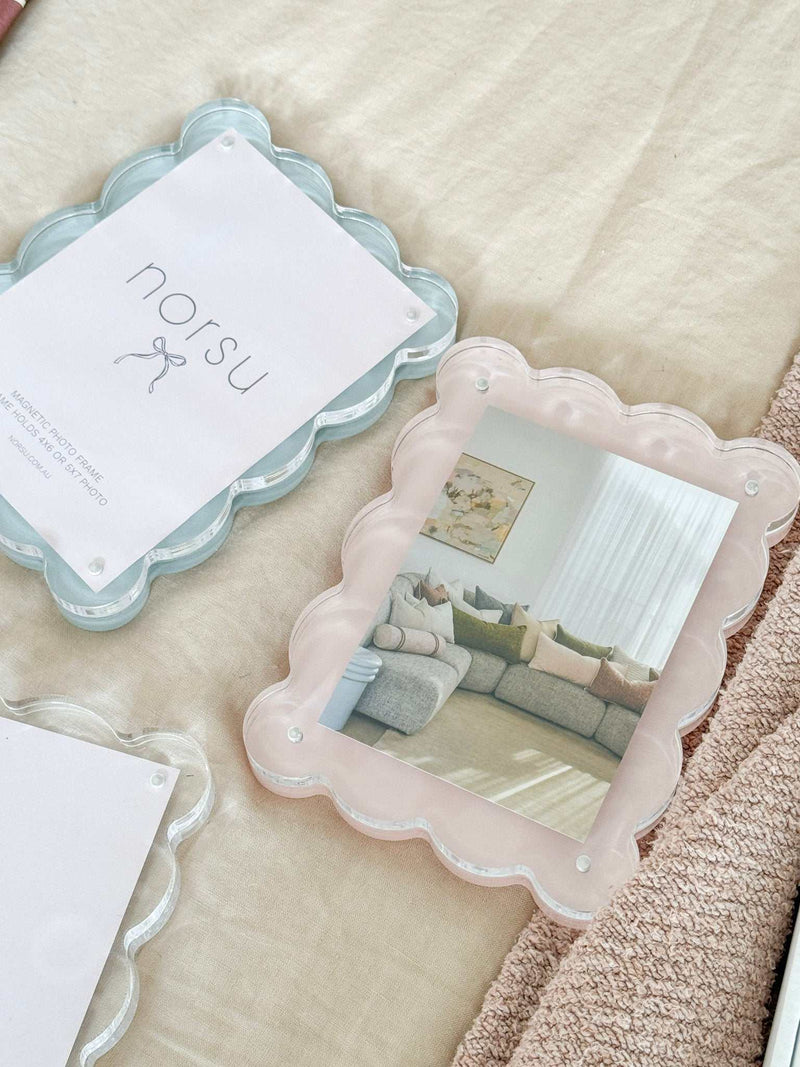 norsu Studio Scalloped Magnetic Photo Frame with blue scalloped edges and secure magnetic closure displaying a portrait photo