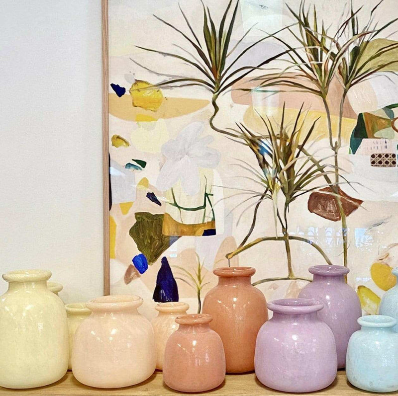 Limited edition Georgie Wilson fine art canvas print Duniper with abstract natural elements and pastel-colored ceramic vases.