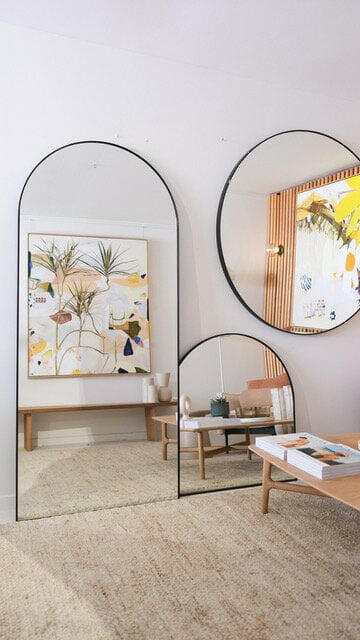 Limited edition fine art canvas print Duniper by Georgie Wilson displayed in modern room with wooden furniture and decorative mirrors