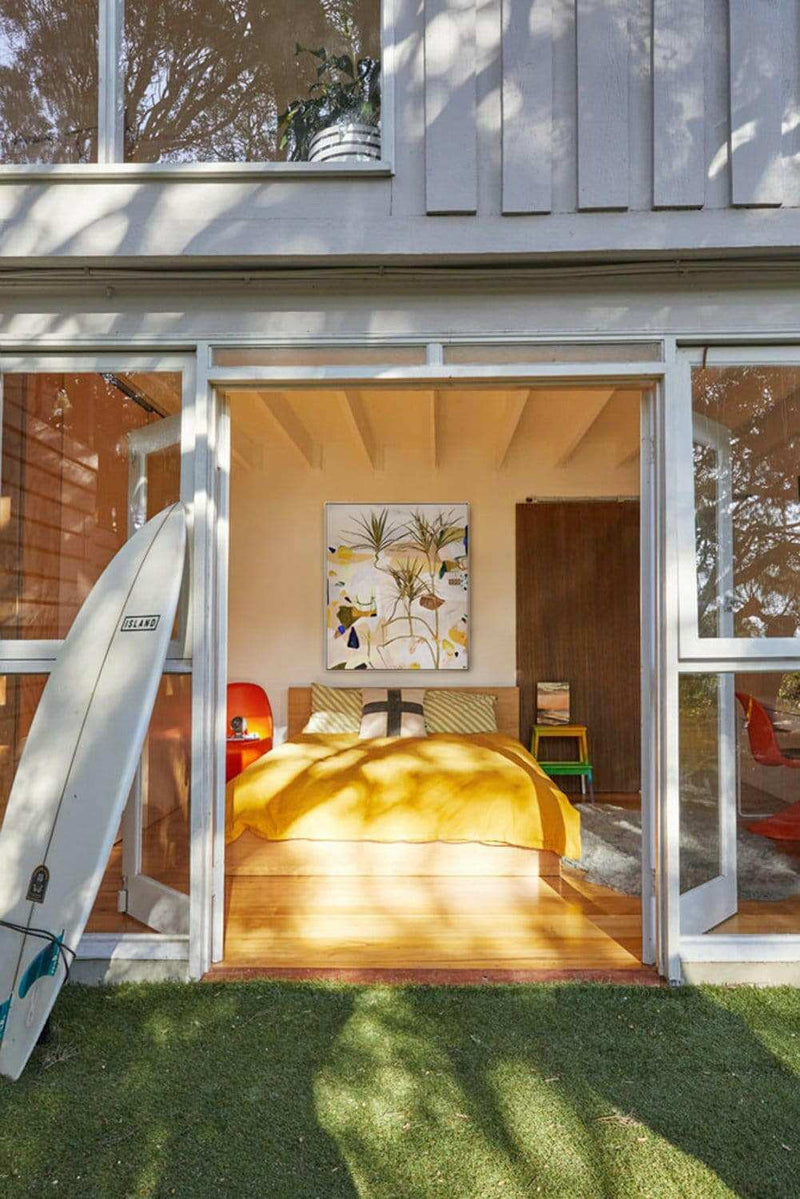 Limited edition Georgie Wilson fine art canvas print Duniper displayed in a modern bedroom setting