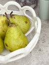 Rye Stoneware Ceramic Basket white ceramic fruit bowl with woven design holding pears on countertop
