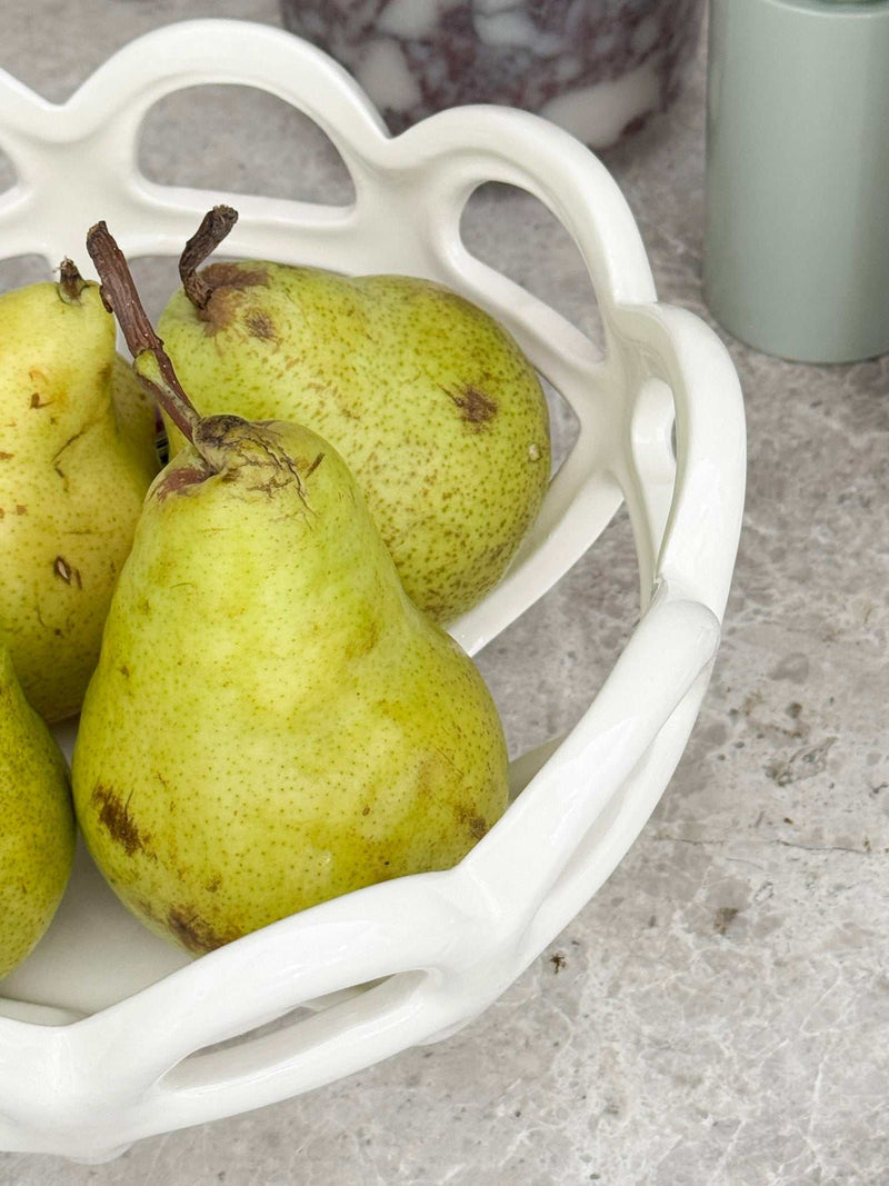 Rye Stoneware Ceramic Basket white ceramic fruit bowl with woven design holding pears on countertop
