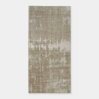 GlobeWest Tepih Tide Rug in oyster color with hand-woven viscose and wool, featuring a ripple ocean-inspired design for indoor use.