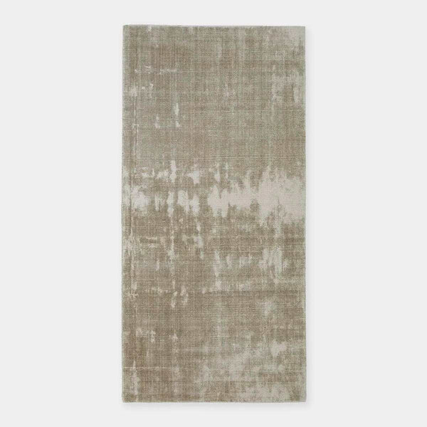GlobeWest Tepih Tide Rug in oyster color with hand-woven viscose and wool, featuring a ripple ocean-inspired design for indoor use.