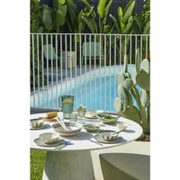 Davis & Waddell Salad Bowl in dark green bamboo fibre with wiggly stripe pattern on outdoor table next to pool