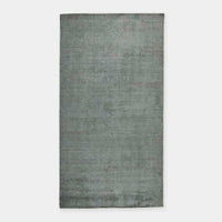 GlobeWest Tepih Neptune rug in ocean green, hand-loomed wool, silk, and cotton blend, indoor area rug with rustic texture