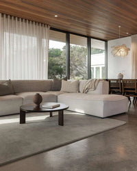 Baya Haywood Floor Rug in slate color made of 100% New Zealand wool with a soft, tonal finish in a modern living room setting