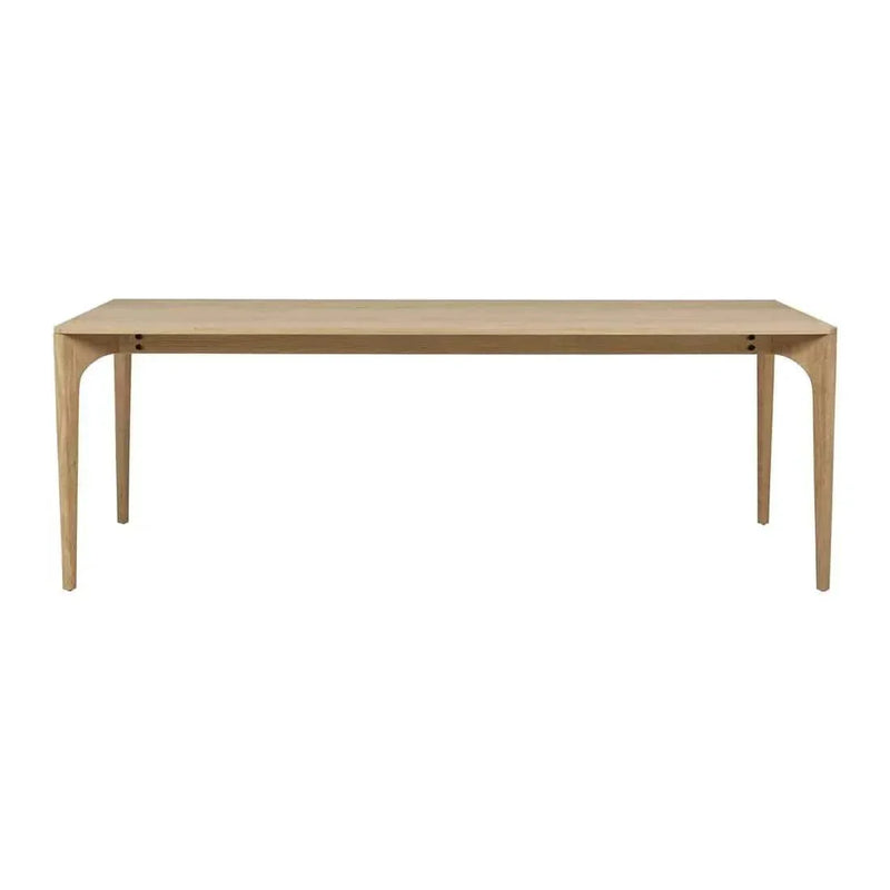 Globe West Huxley Curve Dining Table in natural oak with solid oak legs and oak veneer top, available in multiple sizes.