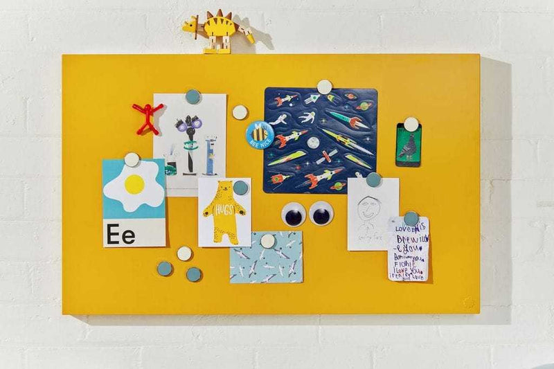 Yellow magnetic Storyboard by Mustard Made with various colorful notes and magnets attached, designed to complement Mustard Made lockers