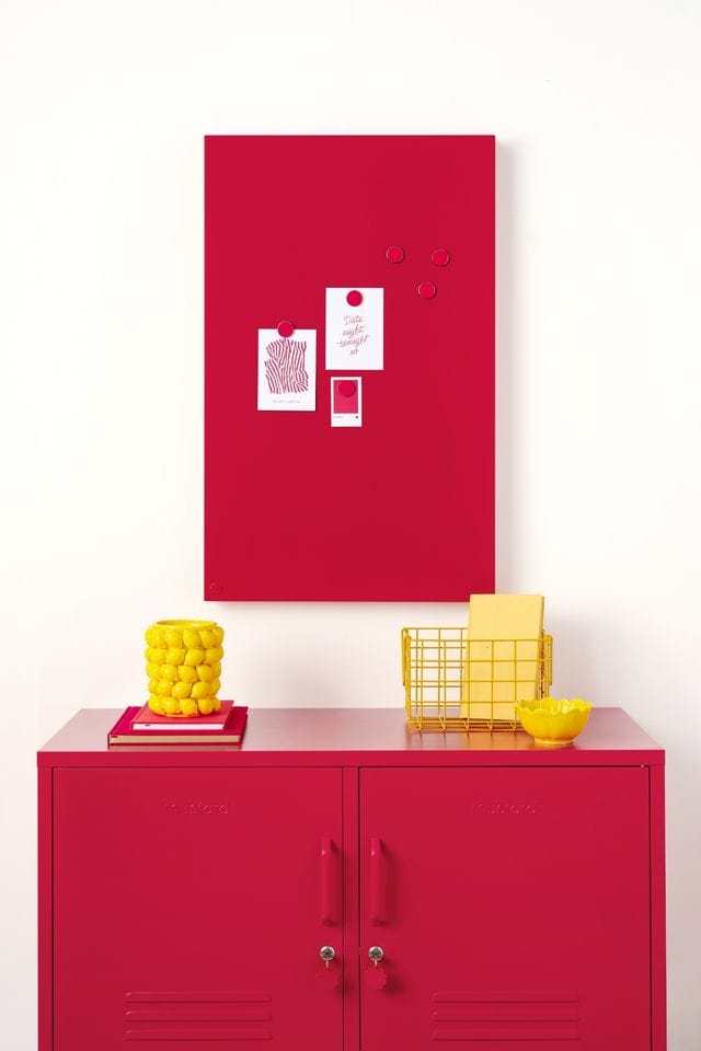 Red magnetic storyboard with notes hanging above matching red Mustard Made lockers