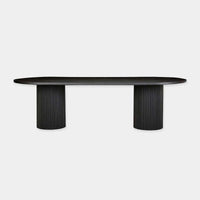 Black Globe West Benjamin Ripple Oval Dining Table with rippled pillar bases and timber ash veneer top