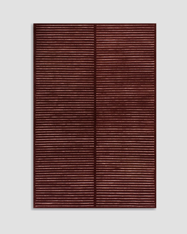 Baya Marlow floor rug in Wine, full rug shown flat on a grey background