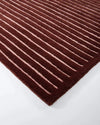 Baya Marlow Floor Rug in wine color with hand-tufted 100% New Zealand wool and linear pattern