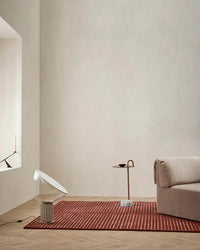 Baya Marlow Floor Rug in wine color with textured high-low 100% NZ wool pile in modern living room setting