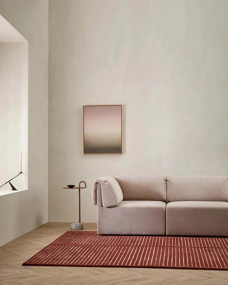 Baya Marlow Floor Rug in wine color with burgundy and pale pink stripes in a modern living room setting