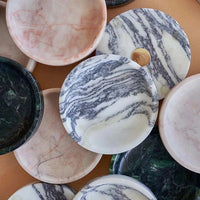 Black Blaze Linea small round marble dishes in rosa, black, and white with smooth edges for serving or display