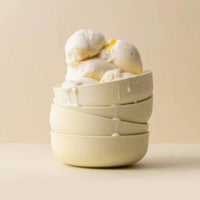 Stacked sorbet-colored Styleware nesting bowls with melting ice cream on top
