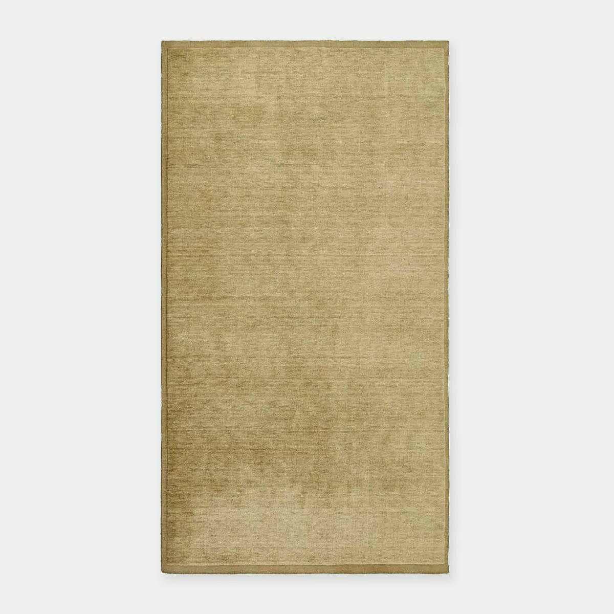 GlobeWest Bower Frame Rug in moss green, handwoven wool, versatile indoor area rug with simple silhouette