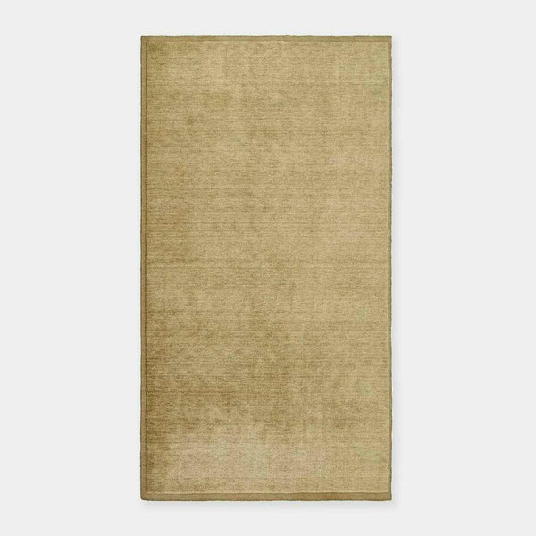 GlobeWest Bower Frame Rug in moss green, handwoven wool, versatile indoor area rug with simple silhouette