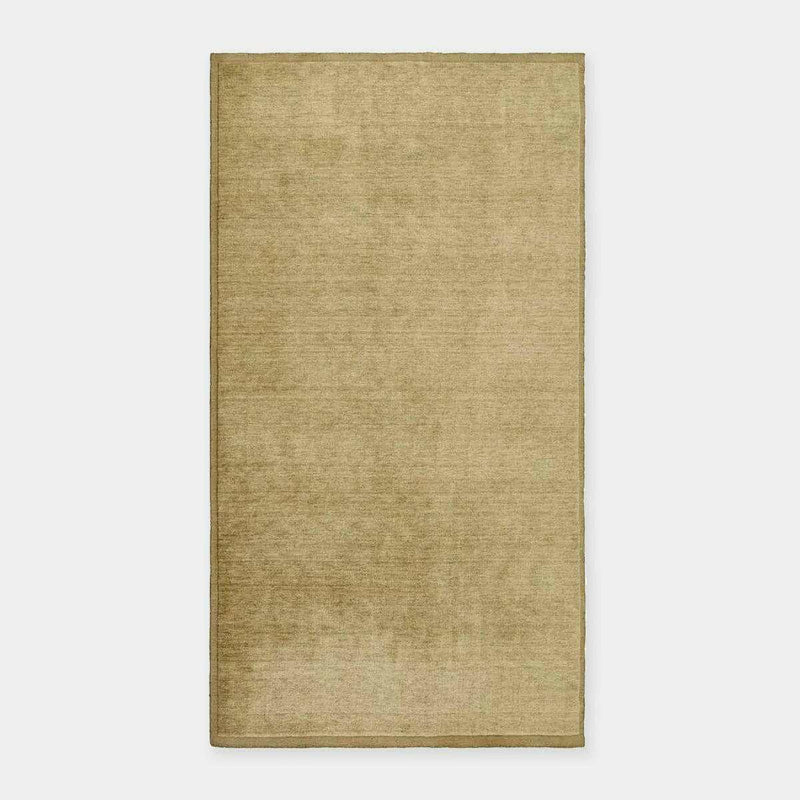 GlobeWest Bower Frame Rug in moss green, handwoven wool, versatile indoor area rug with simple silhouette