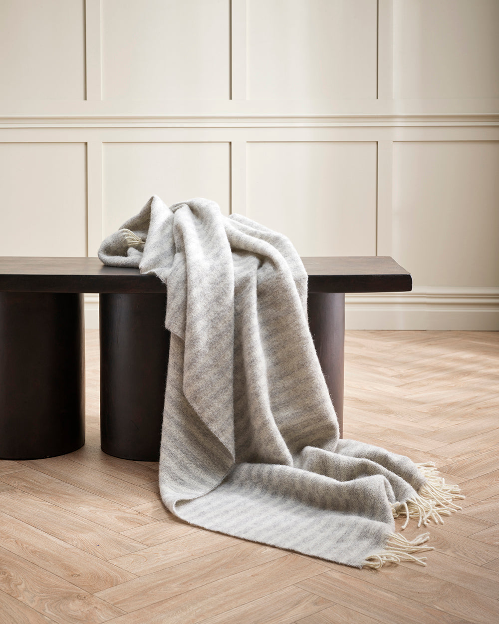 Baya Noah Throw in Silver styled on a sofa