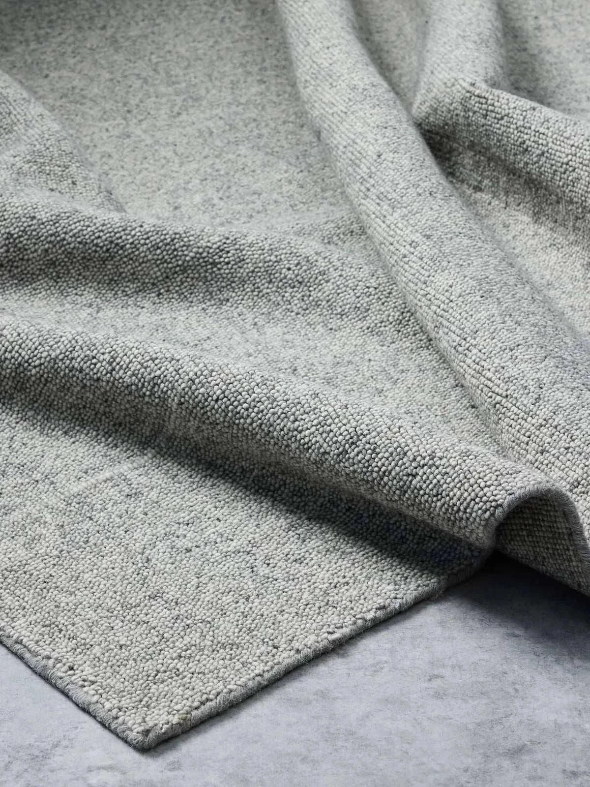 Blue grey Noble Rug with handloomed wool texture and subtle elegant design