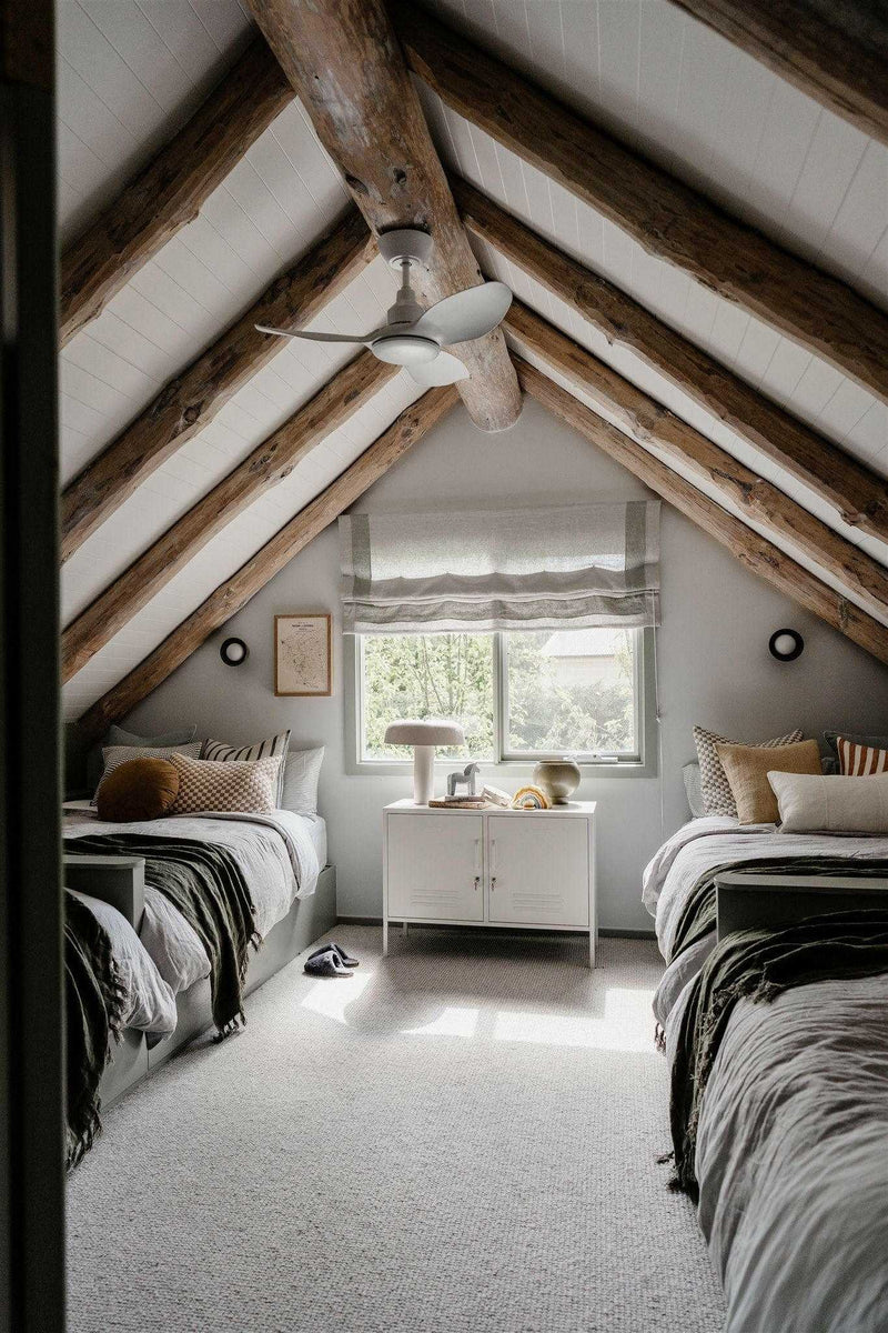 Mustard Made Locker in Chalk finish used as console with handles and locks in a cozy attic bedroom setting