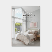 Digital magazine cover showing a bright bedroom with large windows, sheer curtains, neutral bedding, and modern decor in Annabel's bathroom and bedroom chapter.