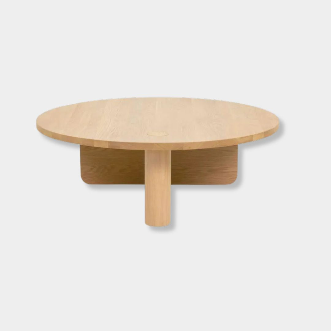 Natadora Pivot coffee table in light oak with asymmetrical base, solid American oak construction, and PU sealer finish