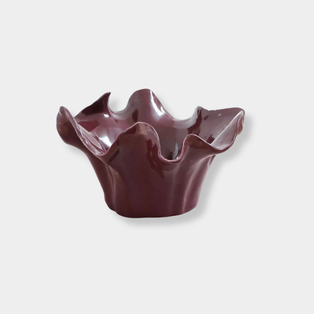 Sculptural burgundy ceramic bowl with ruffled edge from norsu Studio Flow collection