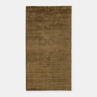 Olive hand-woven GlobeWest Tepih Dune wool blend rug with subtle pattern for indoor use