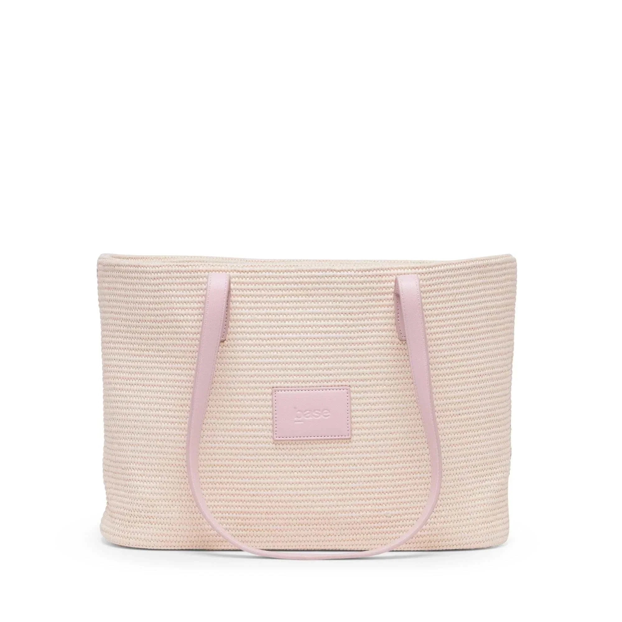 Base Supply Panier lightweight pink woven straw tote bag with over-the-shoulder straps and cotton lining