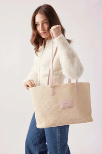 Base Supply Panier pink woven straw tote bag with over-the-shoulder straps and cotton twill lining