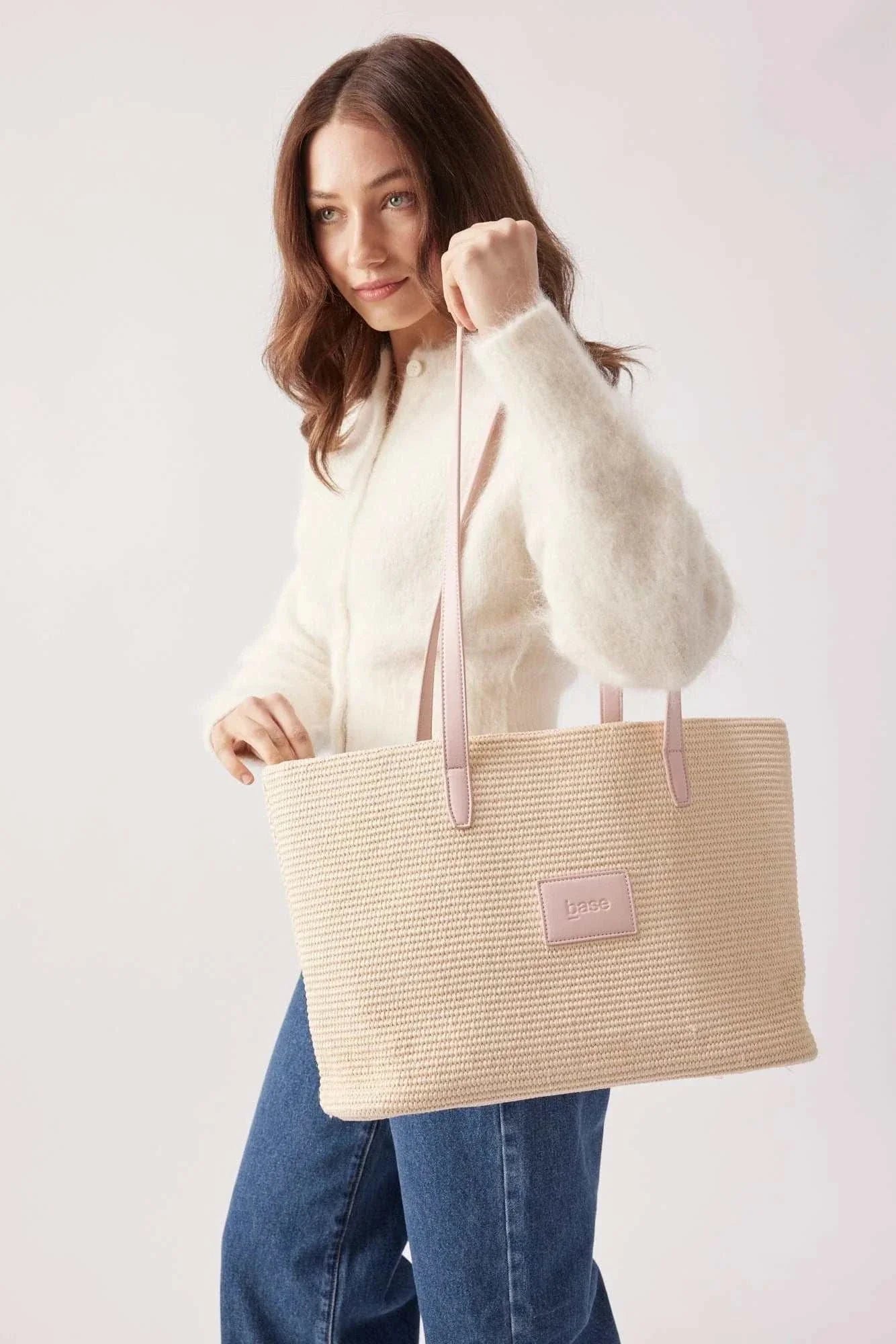 Base Supply Panier pink woven straw tote bag with over-the-shoulder straps and cotton twill lining