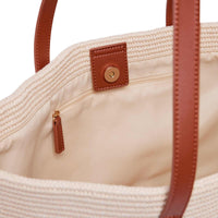 Base Supply Panier tan woven basket bag with cotton lining and leather straps interior view
