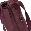 Base Supply Bottle Sling in burgundy with waterproof crinkle fabric, adjustable strap, and front zip pocket