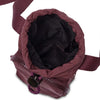 Base Supply Bottle Sling crossbody bag in burgundy with waterproof fabric and adjustable strap