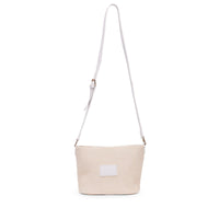 Base Supply Panier crossbody bag in chalk with woven straw texture and adjustable strap