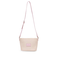 Base Supply Panier Crossbody bag in pink woven straw with adjustable strap and zip-top closure