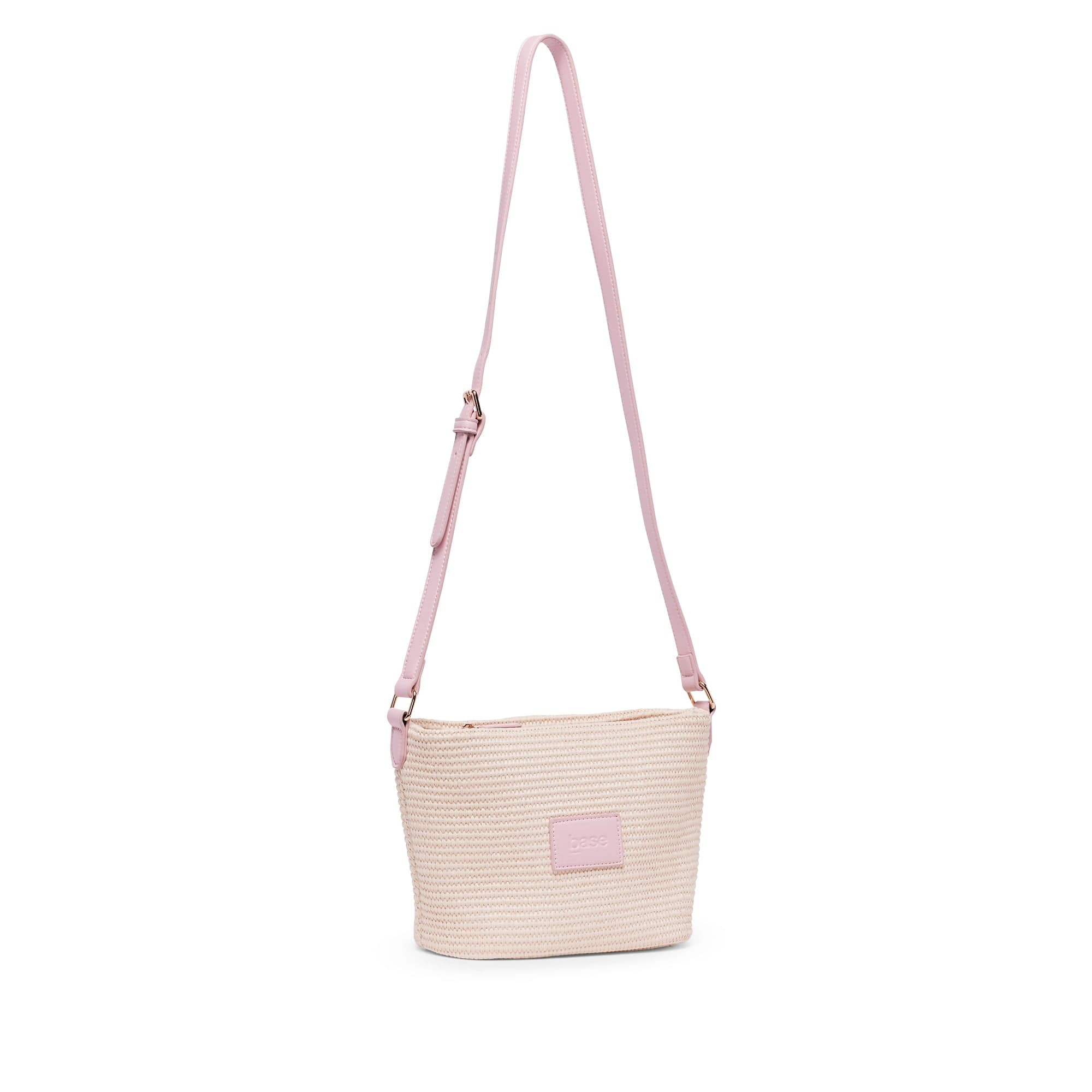 Base Supply Panier Crossbody pink woven straw bag with adjustable strap and zip-top closure